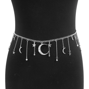 Detail of silver star and moon waist chain with rhinestones on a display torso