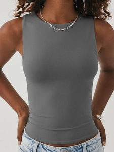 Close-up of dark grey ribbed knit fabric and sleeveless fit on a slim cropped tank top