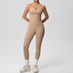 Two-piece nude yoga set featuring slim strap top and high waist leggings in soft fabric