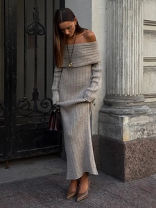 Detailed view of the elegant grey ribbed knit texture and off-the-shoulder neckline design
