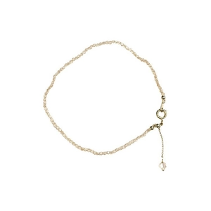 Elegant beaded anklet with champagne crystals and golden clasp on a clean white background