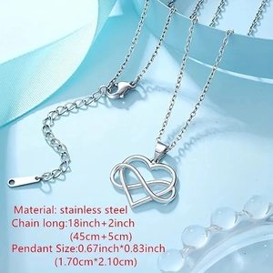 Silver stainless steel heart and infinity necklace on elegant blue silk background