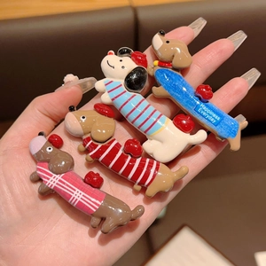 Set of four cute dachshund dog hair clips with colorful striped and plaid patterns