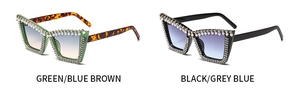 Detail of cat eye sunglasses with pearl and rhinestone accents on oversized colorful frames