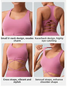 Detail of pink sports bra with V-neckline, racerback design, and wrap-around straps