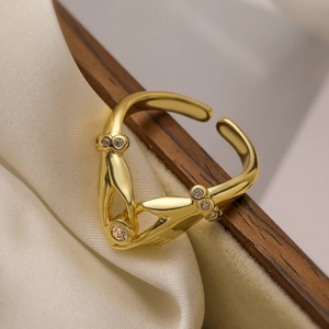 18K gold-plated hands holding heart open ring with sparkling white zircons