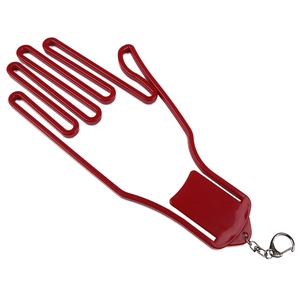 Close-up of red plastic golf glove stretcher with metal keychain on white background