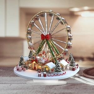 Ruota panoramica natalizia illuminata con villaggio innevato su tavolo in legno