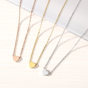 Minimalist heart pendant necklace in gold, rose gold, and silver stainless steel