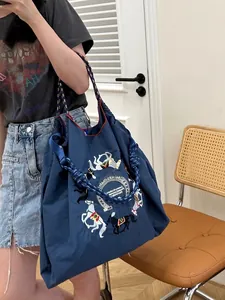 Dark blue nylon tote bag with colorful horse embroidery and woven rope handles