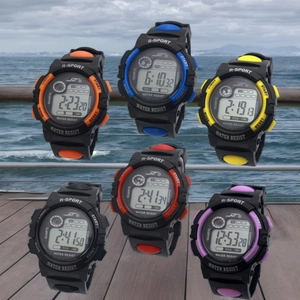 Waterproof digital sports watches for kids in six vibrant colors on wood background