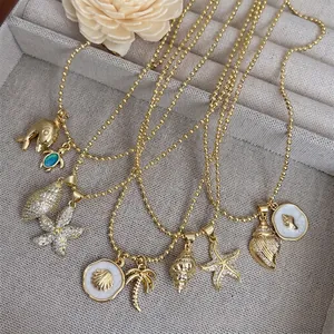 18K gold plated marine necklaces with zircon shell pendants for men on gray tray