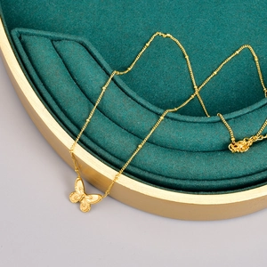 Elegant 18K gold-plated stainless steel butterfly pendant with satellite chain on green velvet