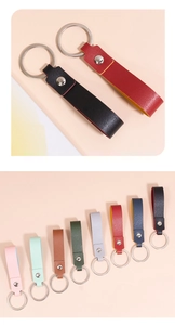 Close-up of double-sided lychee grain leather keychains in multiple vibrant colors