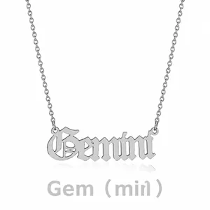 Detailed view of silver stainless steel Gemini zodiac necklace with gothic lettering