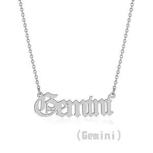 Detailed view of silver stainless steel Gemini zodiac necklace with gothic lettering