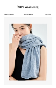 Close-up of premium light grey-blue 100% wool scarf showcasing soft knit texture and warmth