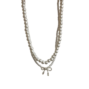 Elegant double-layered pearl necklace with shimmering zircon bow pendant for women