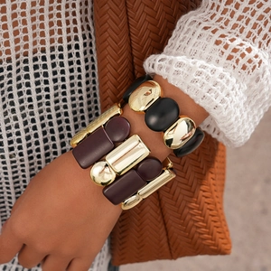 Bold geometric acrylic cuff bracelet with gold metal and matte black chunky square links