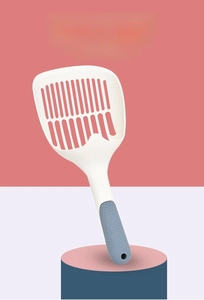 Close-up of thickened cat litter scooper with grey non-slip handle and hanging hole