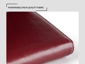 Macro shot of fashionable high-quality wine red oil wax leather texture and fine grain detail