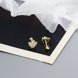 Close-up of golden crown stud earrings with square cubic zirconia and screw back