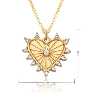 Macro view of gold heart pendant with cubic zirconia and 21mm by 20mm dimensions