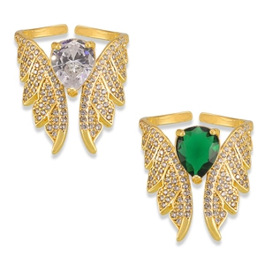 Bohemian gold angel wing rings with white and green stones in a studio setting