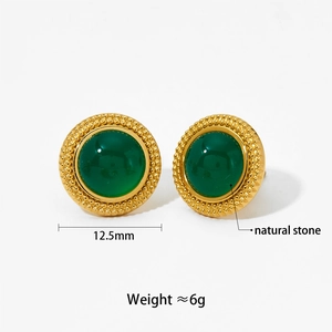 Detail of round green natural stone stud earrings in gold plated stainless steel