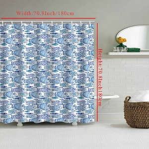 Close-up of 180x180cm shower curtain featuring blue fish print in a bright bathroom