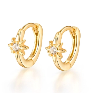Detail view of gold star hoop earrings featuring micro-set sparkling zircon stones