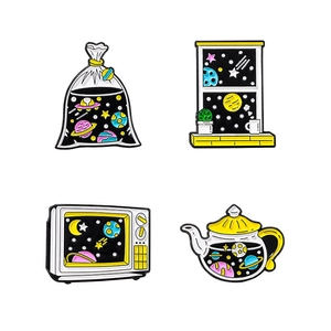 Space-themed enamel lapel pins with stars and planets in TV and teapot shapes