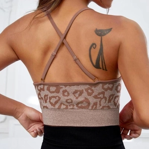 Cross-back leopard print sports bra with adjustable straps and ribbed hem for yoga