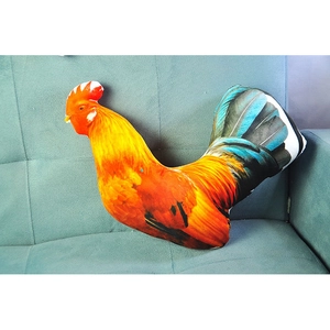 Realistic cartoon rooster plush pillow with 3D print feathers on blue sofa