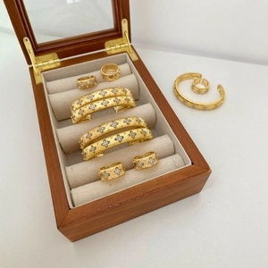 Italian style brushed gold jewelry set featuring starry diamond rings and open cuffs