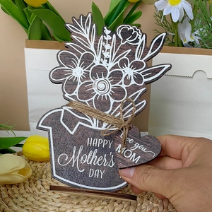 Detail of wooden Mother's Day flower ornament with Happy Mother's Day engraving