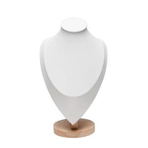 Detail showing white leather necklace display bust with round solid wood base