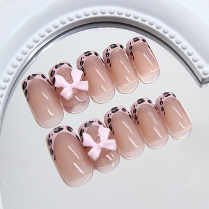French leopard print press-on nails with 3D pink bows and long square coffin shape