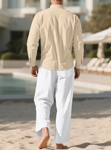 Men's cotton linen set featuring a beige long sleeve shirt and white trousers for vacation
