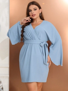 Elegant light blue V-neck dress with lantern sleeves and a waist belt for women