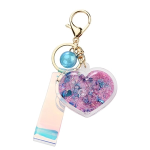 Glittering heart quicksand keychain with pink and purple sequins and gold clasp