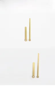 Detail view of model 305 matte gold quartz clock hands with precise round mounting holes