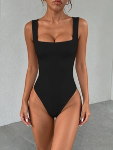 Close-up of black Y2K style slim fit bodysuit with wide straps and square neckline