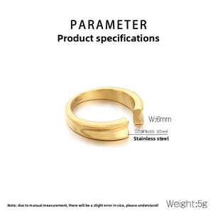 Macro detail of 6mm wide gold stainless steel ring with brushed finish and V-groove design