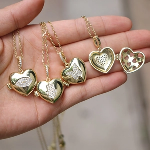 Golden heart locket necklace collection with zircon Evil Eye and butterfly designs