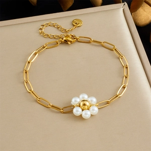 Elegant stainless steel gold chain bracelet with white pearl flower charms and S.Steel tag