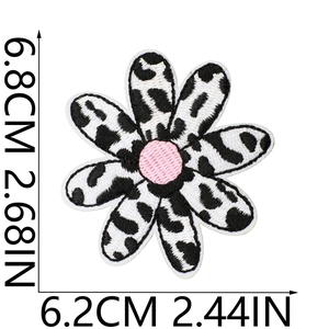 Flower embroidery patch with leopard print petals and dimensions of 6.8cm by 6.2cm