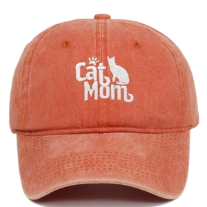 Detailed embroidery of Cat Mom text and silhouette on a washed brick red cotton baseball cap