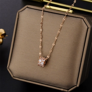Elegant rose gold hourglass pendant necklace with zircon inlay on a luxury jewelry box