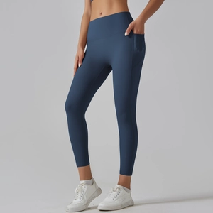 Detail view of high waist navy yoga leggings with side pockets and seamless fit